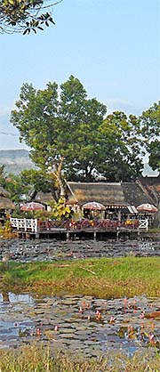 'Restaurant Terrace at a Lotus Pond in Hongsa' by Asienreisender